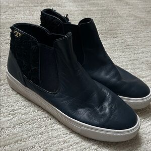 Women’s navy all leather high top sneaker. White sole